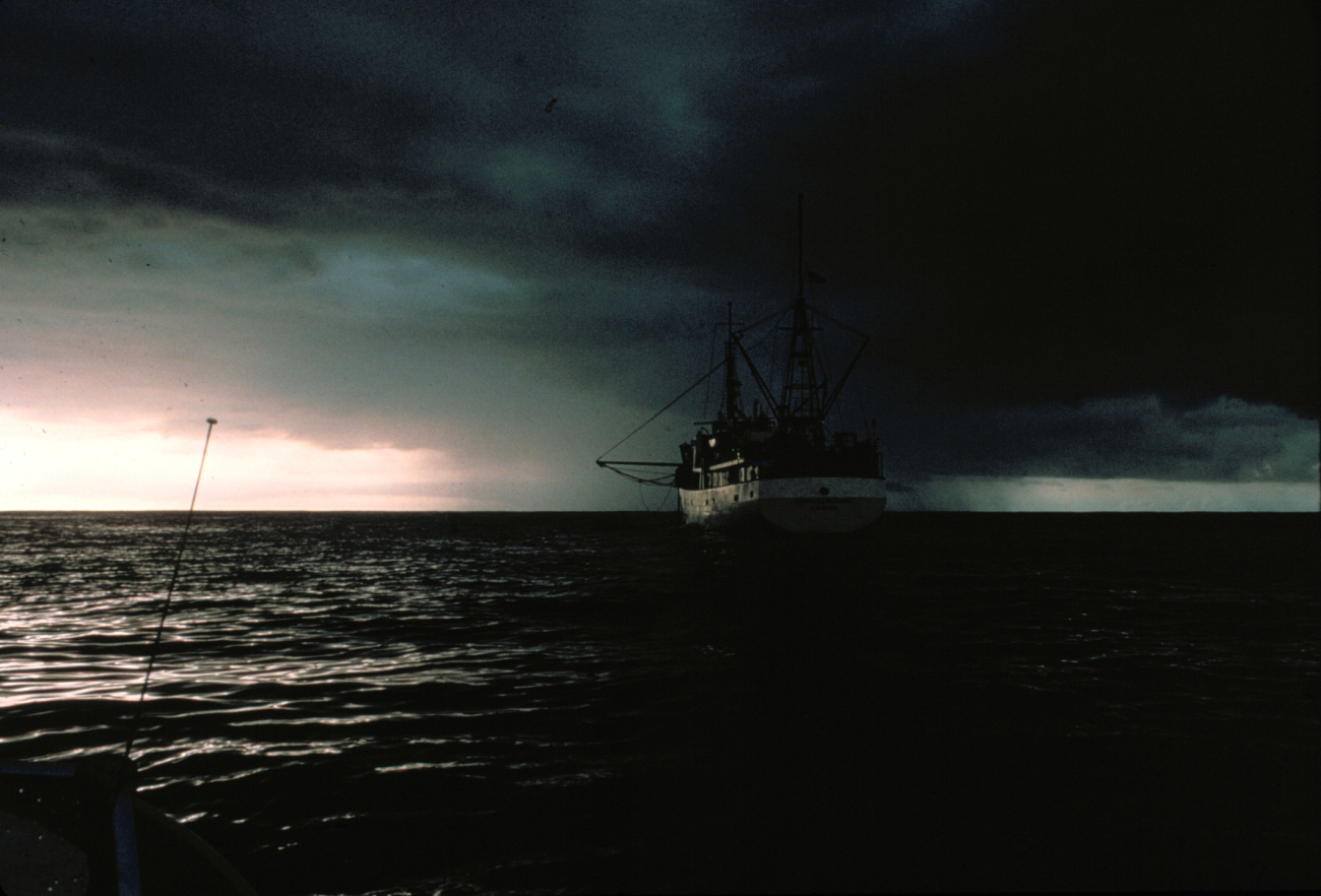 Cumulonimbus with research vessel in foreground