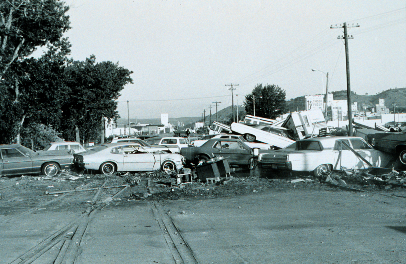 A heap of cars carried downstream by the force of a great flash flood