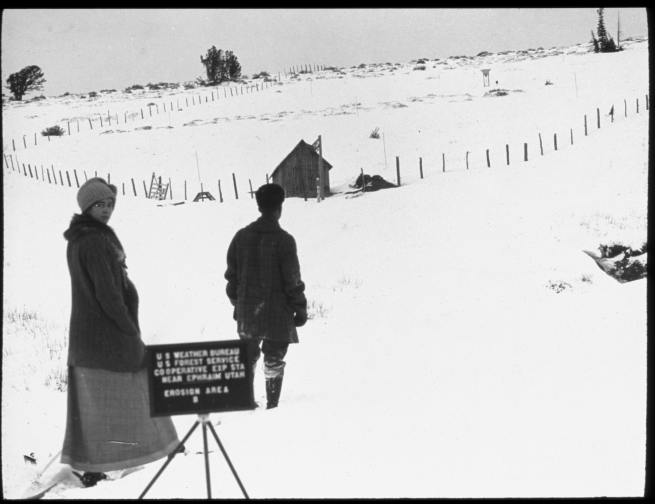 Weather Bureau observer and wife on snowshoes approaching the Weather Bureau/Forest Service cooperative site outside of Ephriam, Utah, for snowobservations
