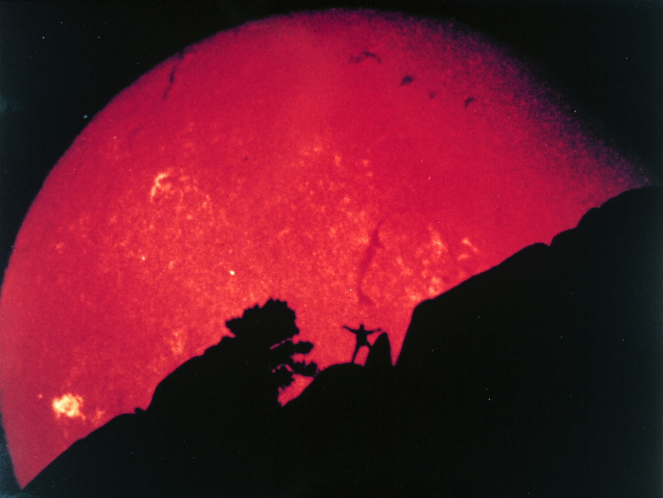 A signature image for SEC, taken from the Boulder Observatory telescope of an enterprising SEC staffer and the Sun setting behind the Flatironsmountains in Boulder