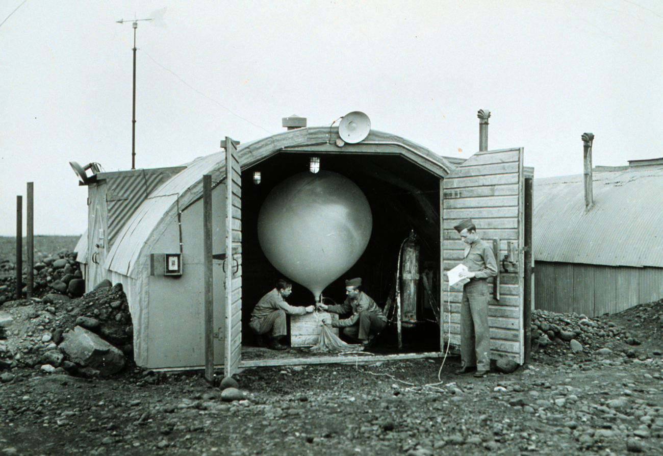 Army Air Force meteorologists prepare to launch hydrogen-filled balloonBalloon transported radiosonde that transmitted back to stationRadiosonde measured temperature, humidity, and pressureThis instrument was used up until just before the end of WWIIIceland post important for shipping and forecasting for European operations