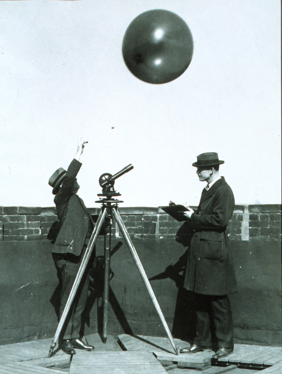 Early testing of hydrogen filled balloons for radiosonde measurementsTheodolite used to track balloon to limit of visibility