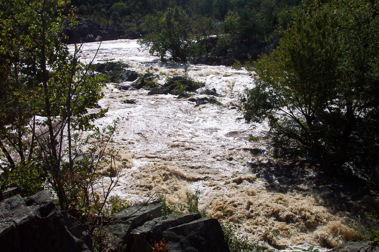 Raging waters flowing out to the main body of the Potomac River during flood