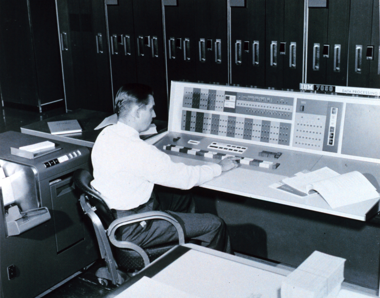A meteorologist at the console of the IBM 7090 electronic computer in theJoint Numerical Weather Prediction Unit