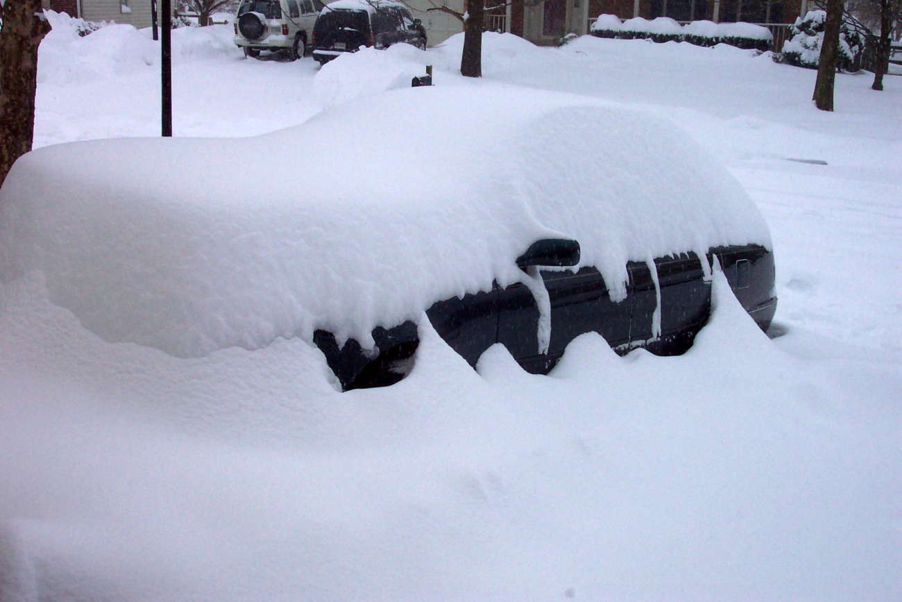 Automobile being covered by snow - Photo #3
