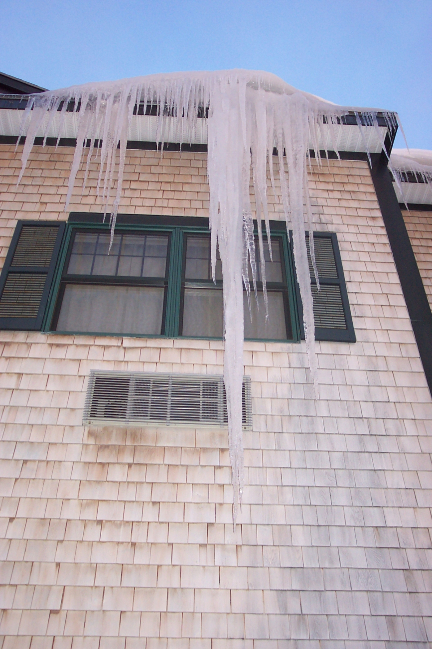 A king-sized icicle hanging from a motel roof