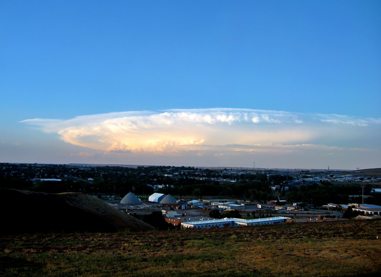 A massive supercell which dropped large hail is visible out the windowof the Rapid City National Weather Service Office