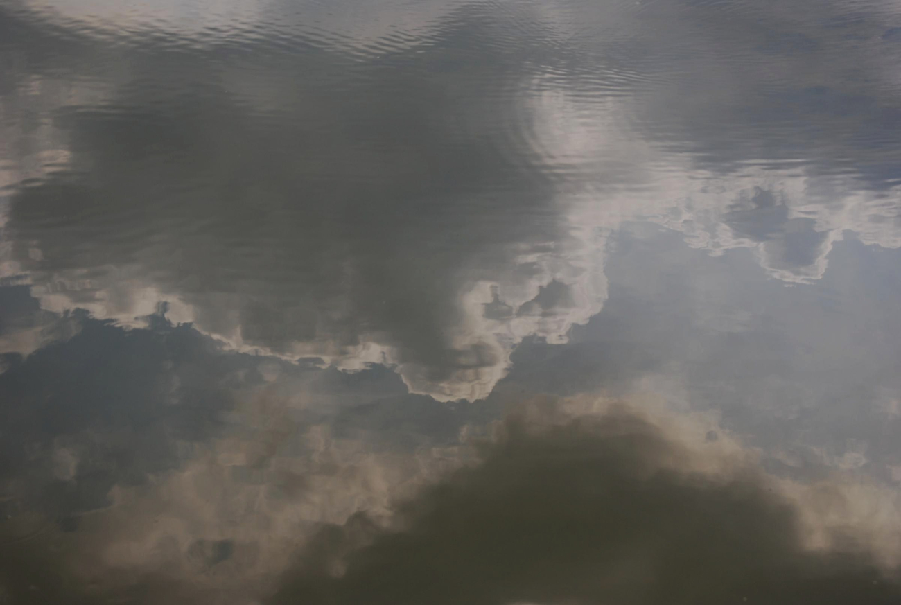 Cloud reflections on a still summer day