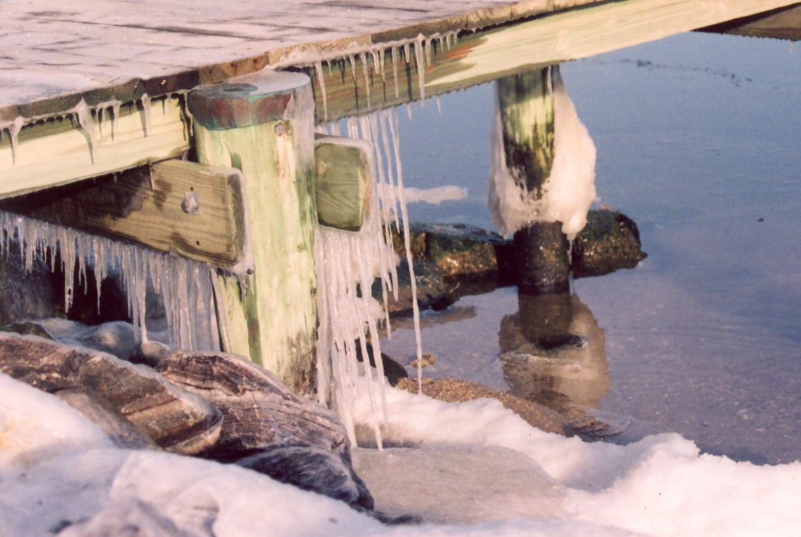 Icy pier as shores of Chesapeake Bay freeze