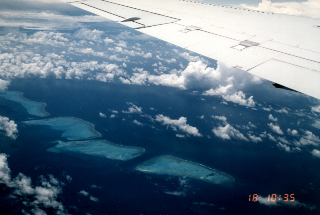Small islands off Papua, New Guinea, as seen from left side of NASA DC-8