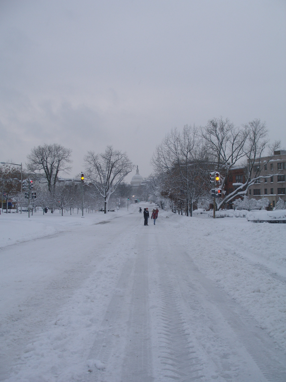 People out enjoying the Capitol Hill area of DC on a vehicle-deserted streetfollowing the February 5-6 snowstorm