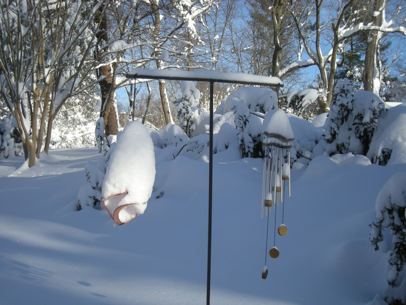Wind chimes covered by snow