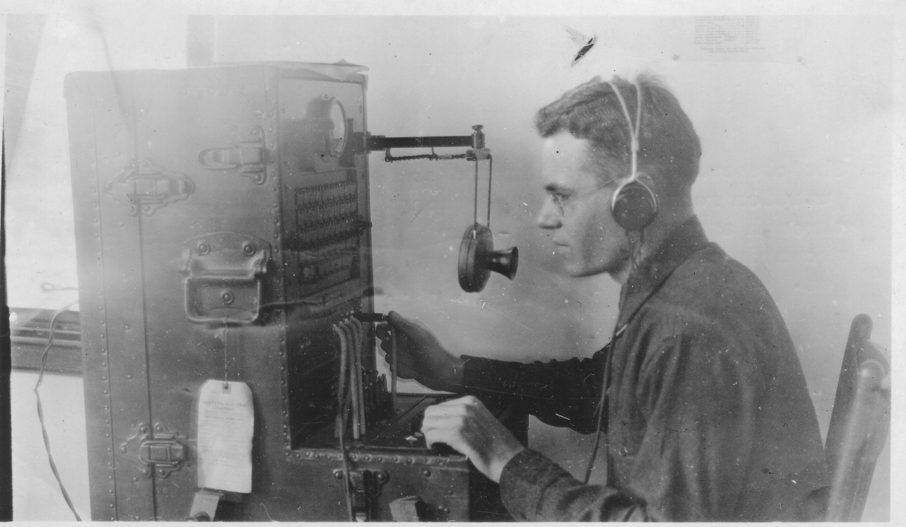 Signal Corps communications specialist using state of the art equipment totransmit and acquire weather information