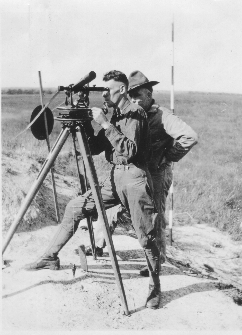 Signal Corps meteorological students Keyte and Arnold practicingusing theodolite to observe weather balloon azimuth and angular altitude