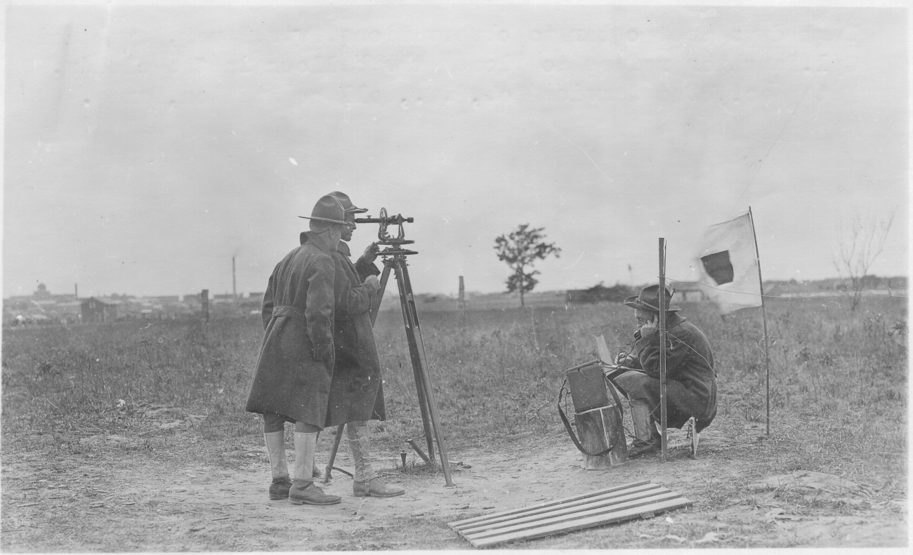 Signal Corps meteorological students Keyte and Bauer practicingusing theodolite to observe weather balloon azimuth and angular altitude