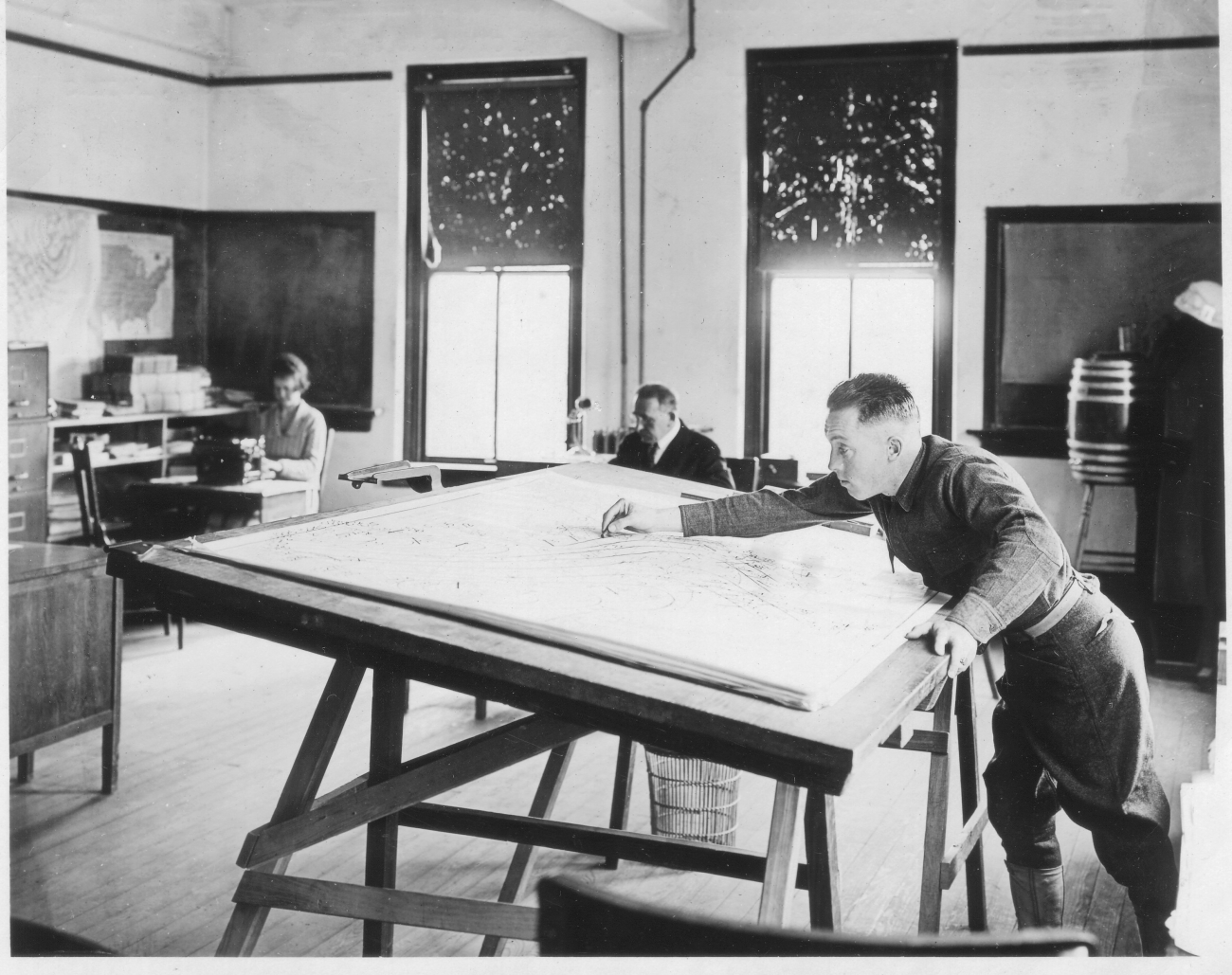 Signal Corps meteorological student Naughton preparing a weather map