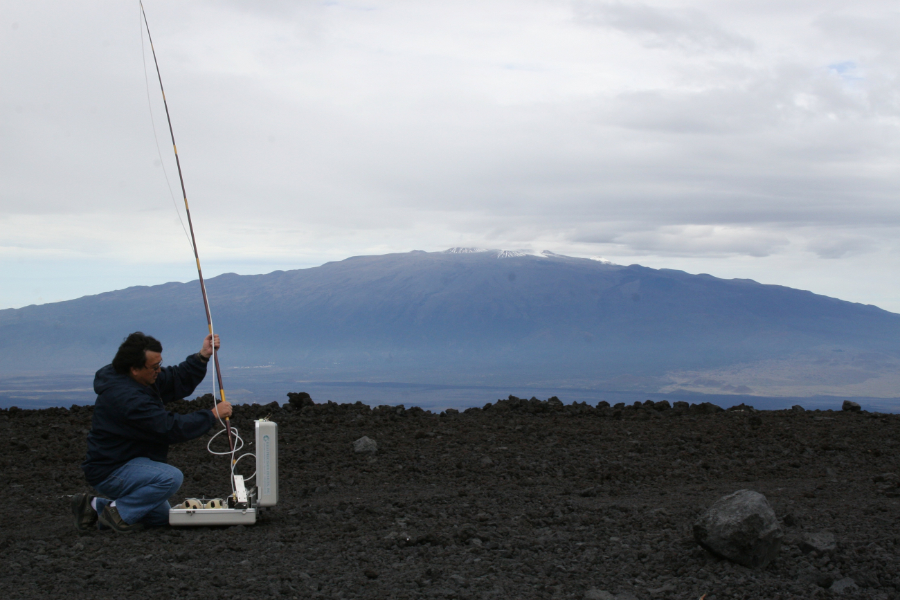 NOAA engineer Paul Fukumura-Sawada captures air near NOAA's Mauna LoaObservatory in Hawaii, using one of many methods to measure carbondioxide and other greenhouse gases in Earth's atmosphere