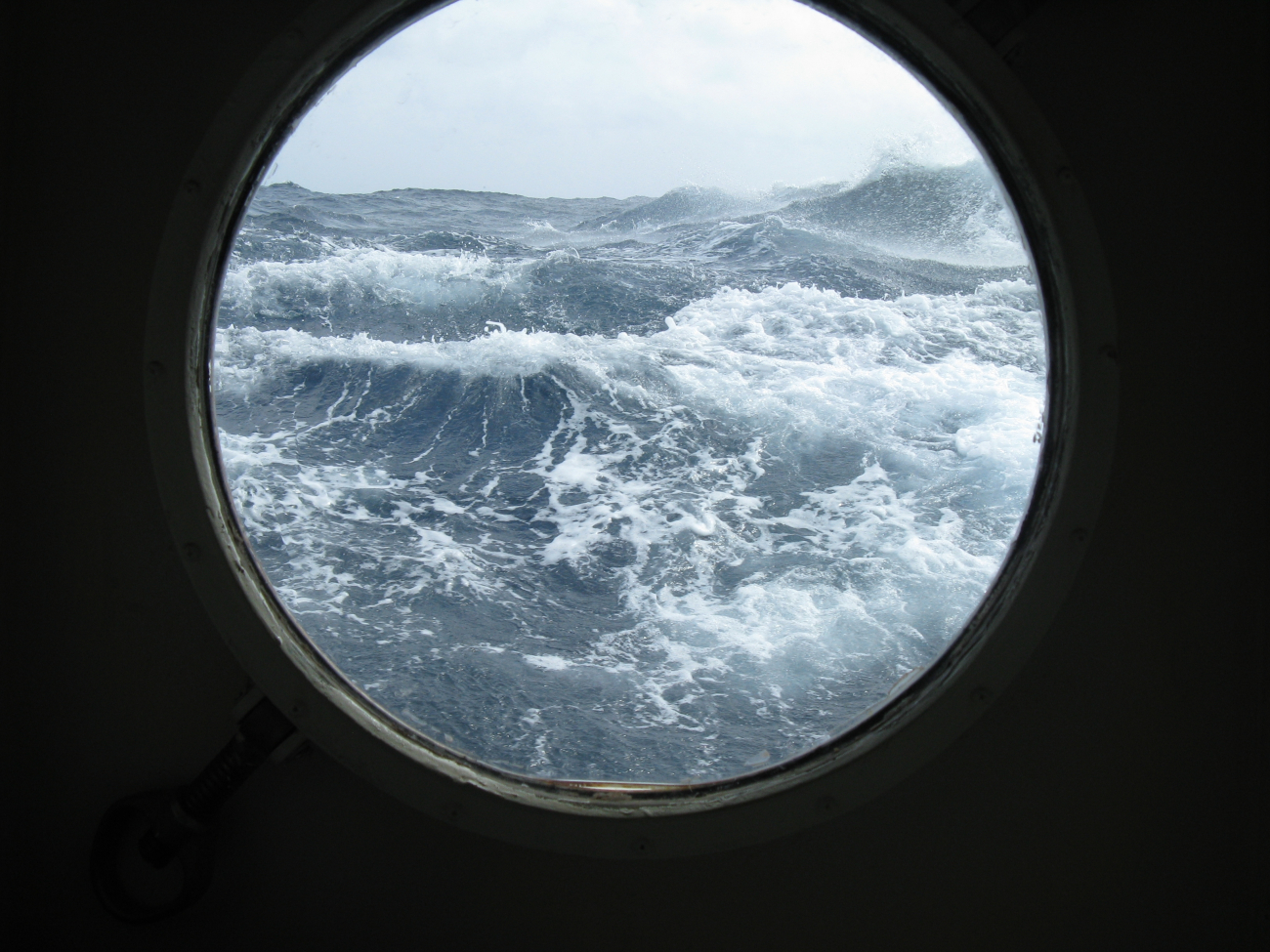 Porthole view of rough seas in the Gulf of Mexico
