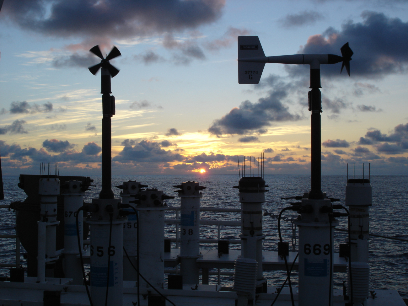 Sunset at sea seen over buoy weather sensors