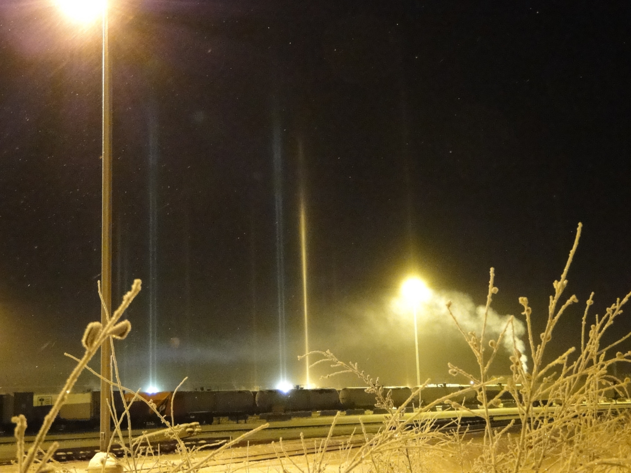 Light pillars penetrating ice fog at the Fairbanks train station
