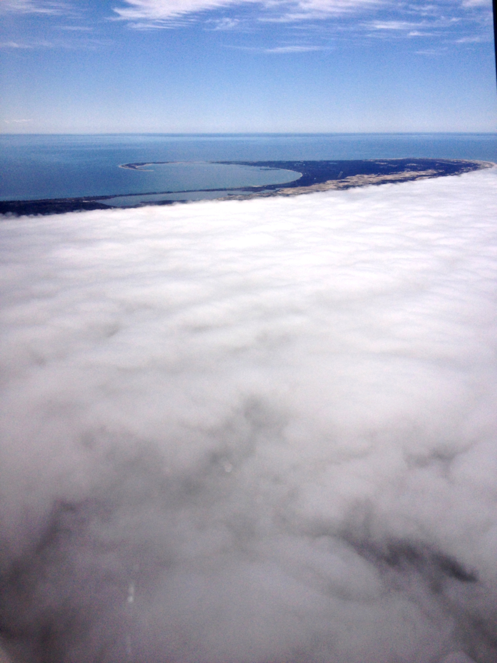 Fog on the Atlantic side of Cape Cod with Provincetown and Massachusetts Bayseen in the upper third of the image
