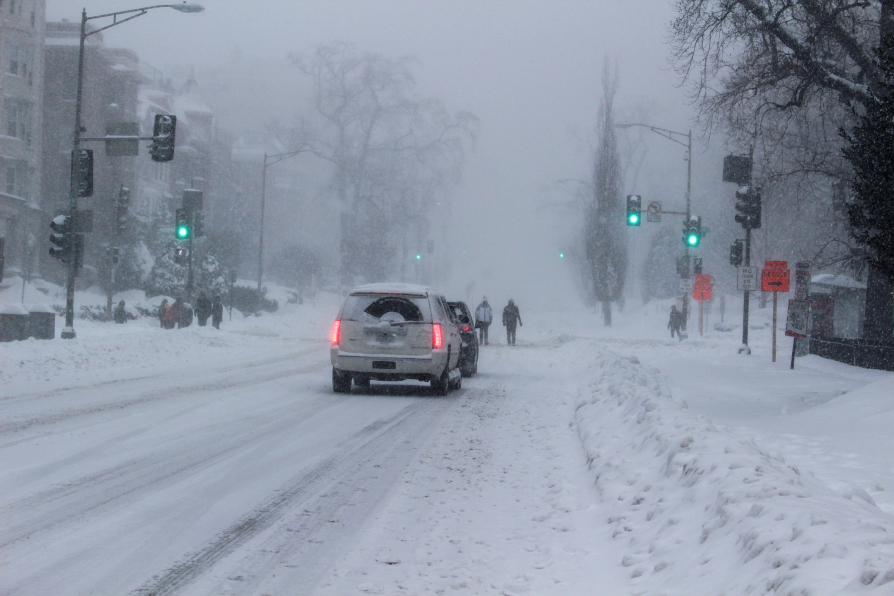 Cars and pedestrians on a snowy road - not a good combination duringSnowzilla