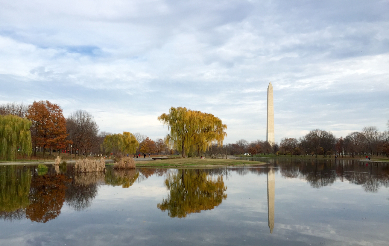 The Washington Monument reflected in a placid waterway on anautumn day