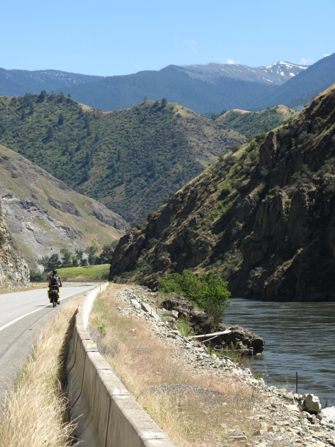 The Salmon River Canyon with a touring cyclist enjoying a beautiful day