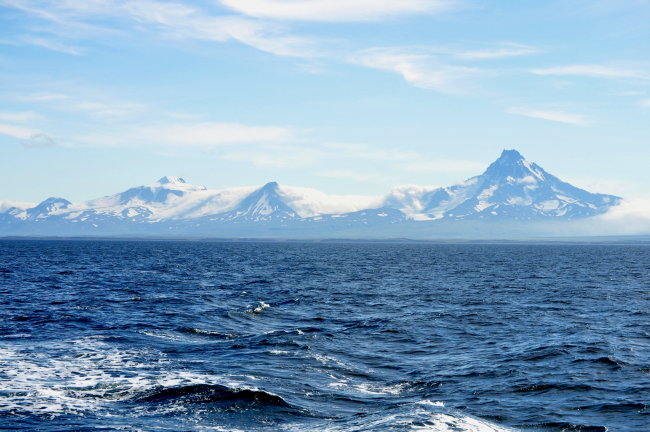 Roundtop Volcano to the left (east) and Isanotski Volcano as seen fromthe Bering Sea side of Unimak Island