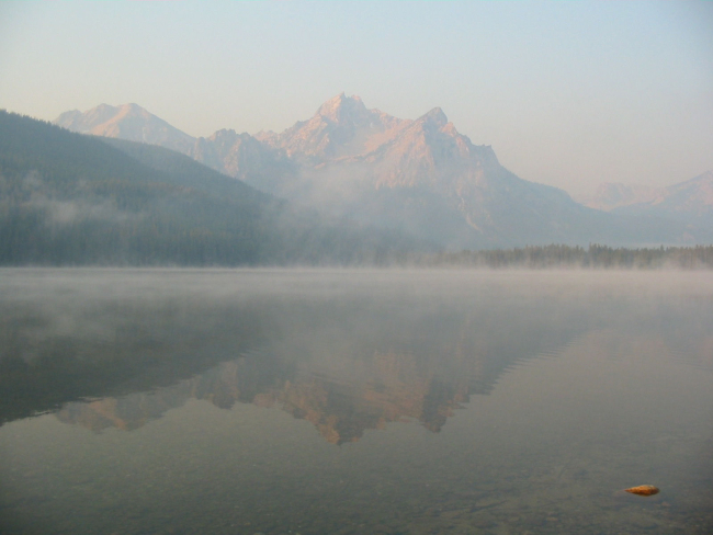 Morning mist and a shimmering reflection on Stanley Lake