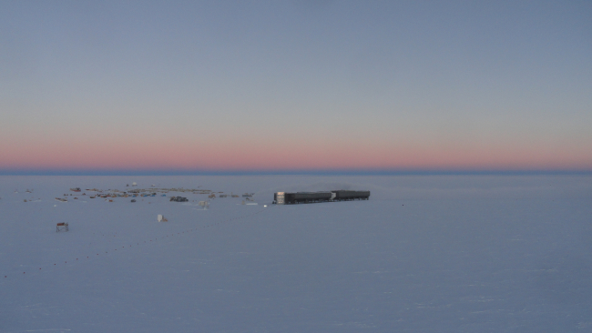 The pink haze of a long twilight at South Pole Station