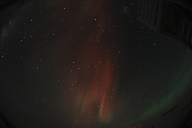 A red aurora australis over the South Pole