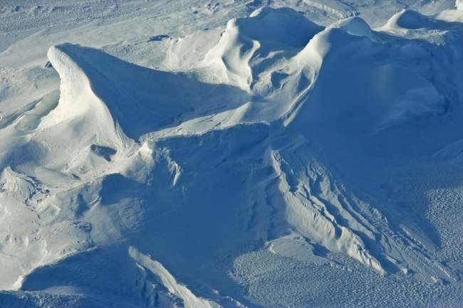 Wind-sculpted snow known as sastrugi