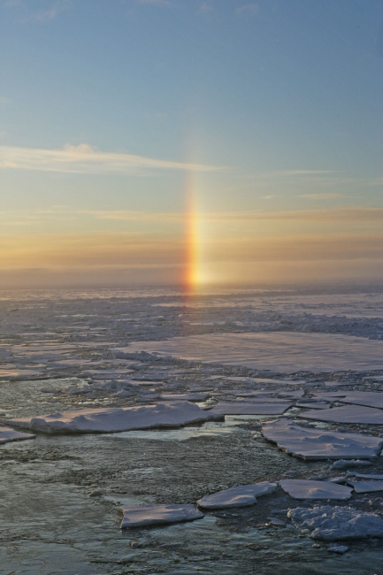 A sun dog - an atmosphere phenomenom caused by refraction of sunlightthrough ice crystals in the atmosphere