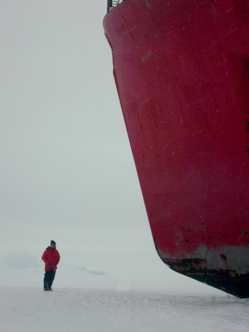 Scientist standing next to the bow of the U