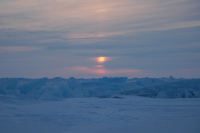 Sunset or sunrise over ridge in ice