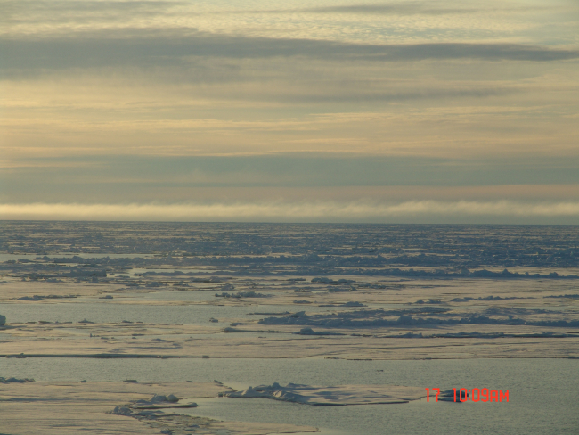 Different layers of clouds give a striking view of melting ice floes