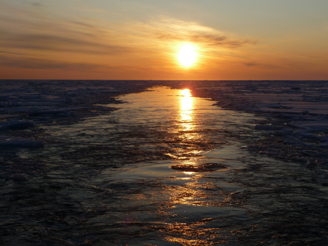 Passing through ice floes with the sun astern