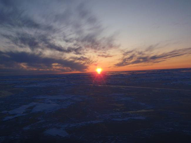 Helicopter eye view of a freezing world at dusk