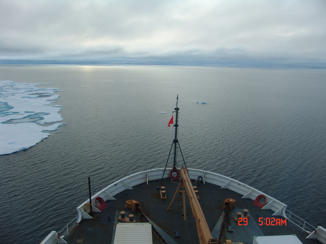 Looking over the bow of the USCGC HEALY towards open water with the edge ofan ice floe on the port bow