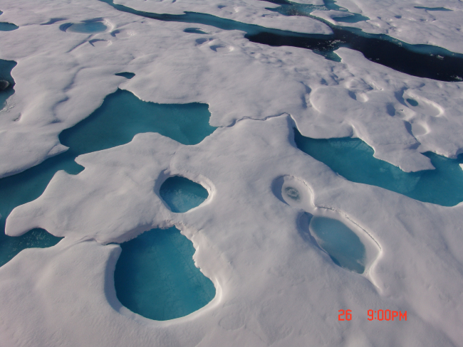 Refreezing melt ponds leave aquamarine patterns in multi-year ice