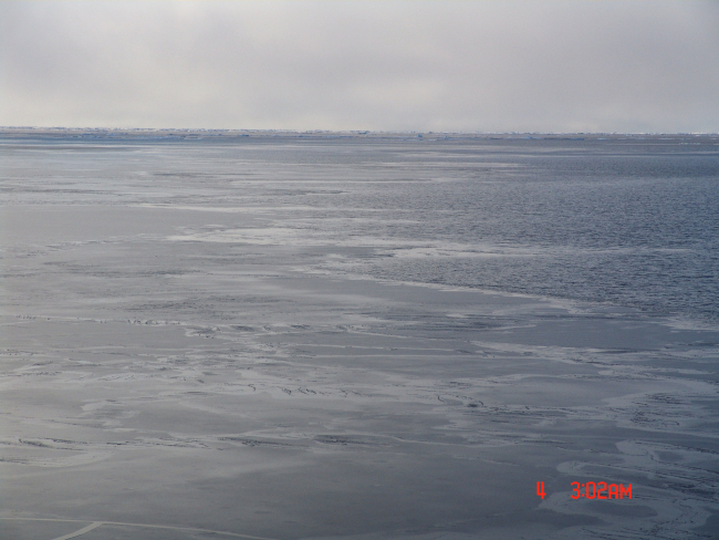 Nilas ice with open water and frazil ice to the right