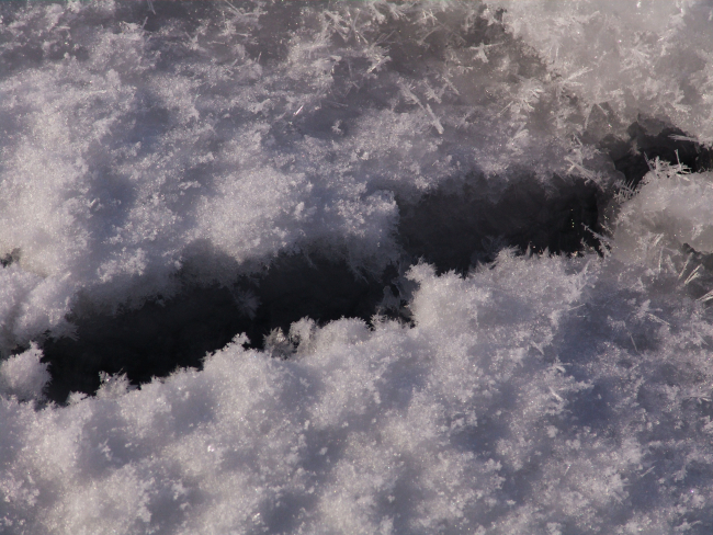 Ice crystals at small break in ice surface