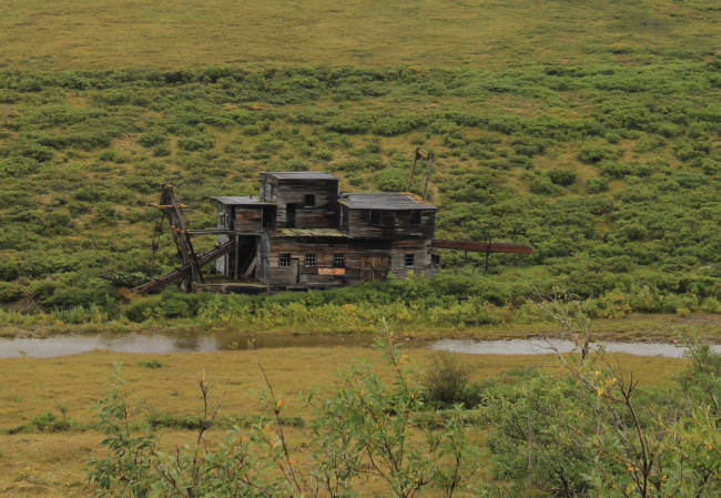 A deserted gold dredge along the Nome to Council road