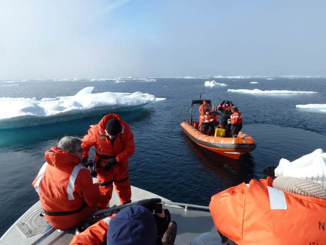 NOAA ship FAIRWEATHER boats among ice floes