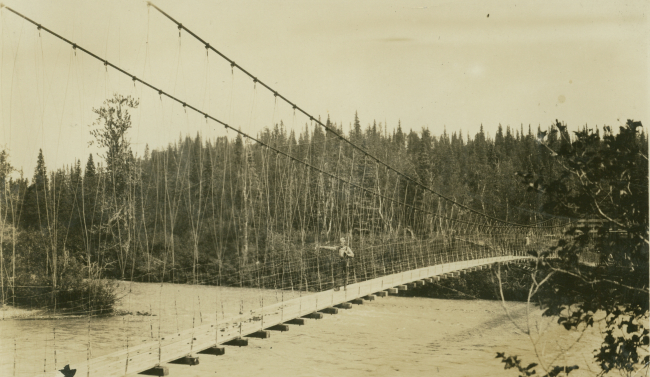 Crossing over one of the many rivers in central Alaska on a suspension bridge