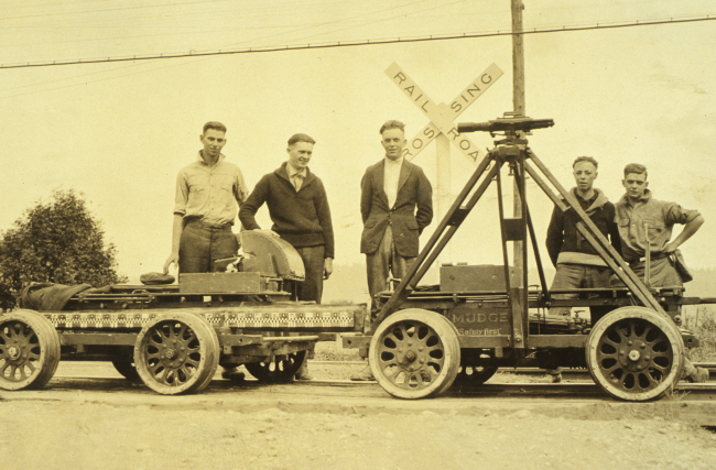 Level crew posing with speeders in foreground