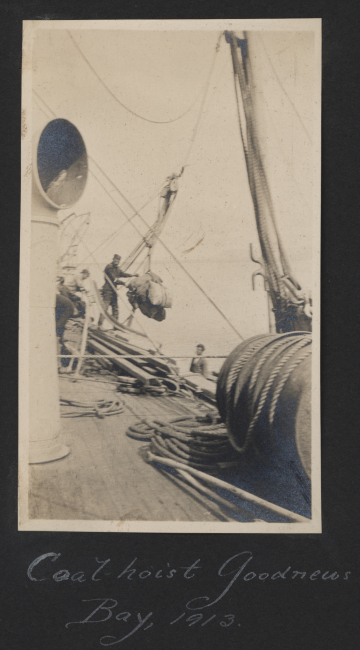Coal being hoisted aboard Steamer EXPLORER from coal barge at Goodnews Bay