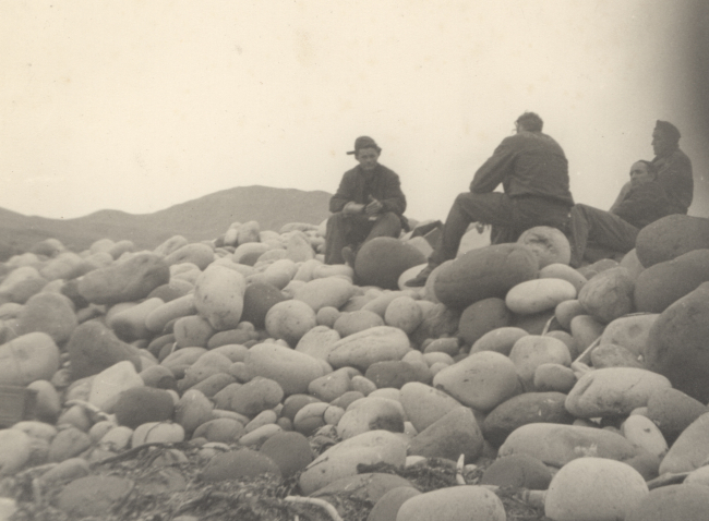 Building party stopped for lunch on a boulder beach