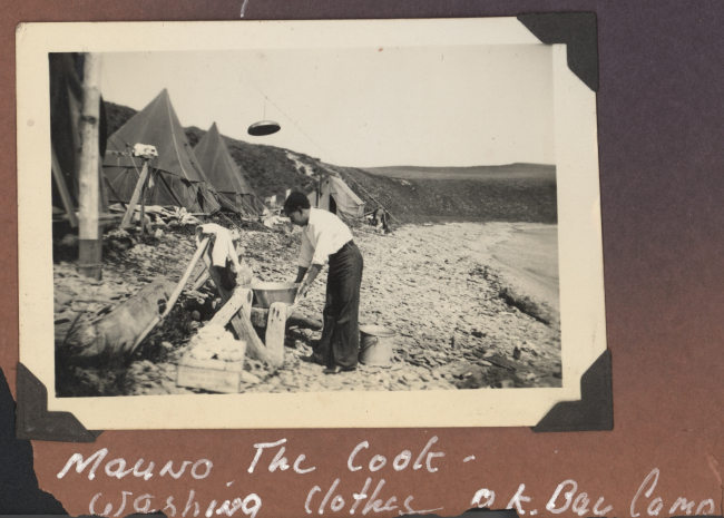 Mauno -the chief cook - washing clothes at OK Bay